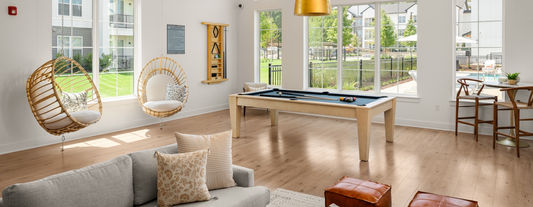 Resident lounge with pool table and hanging chairs